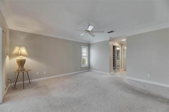 empty room with a ceiling fan, ornamental molding, visible vents, carpet flooring, and baseboards