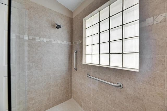 full bathroom with a tile shower