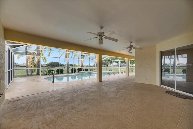 outdoor pool featuring a patio area, ceiling fan, and a lanai