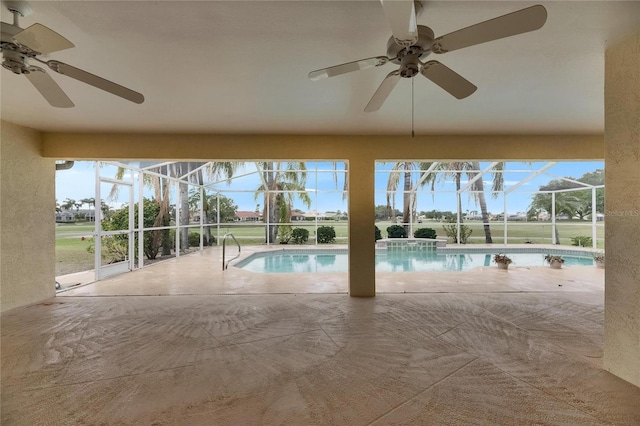 outdoor pool with a patio area, ceiling fan, and a lanai