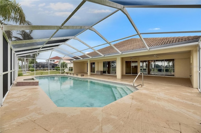 outdoor pool with a ceiling fan, a patio, and glass enclosure