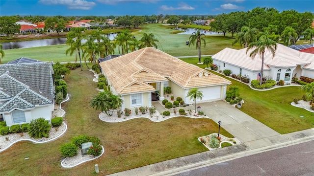 aerial view with a residential view, view of golf course, and a water view