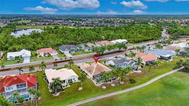 bird's eye view with a residential view and a water view
