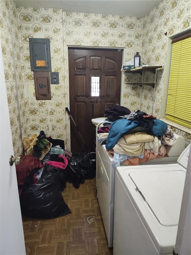 laundry area with wallpapered walls, laundry area, and washing machine and clothes dryer