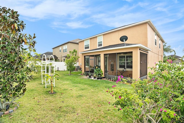 11818 Valhalla Woods Dr, Riverview, FL 33579 - rear view of property with a sunroom and stucco siding