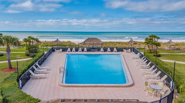 1400 Gulf Blvd Unit 511, Clearwater Beach, FL 33767 - view of swimming pool with a water view, fence, and a view of the beach