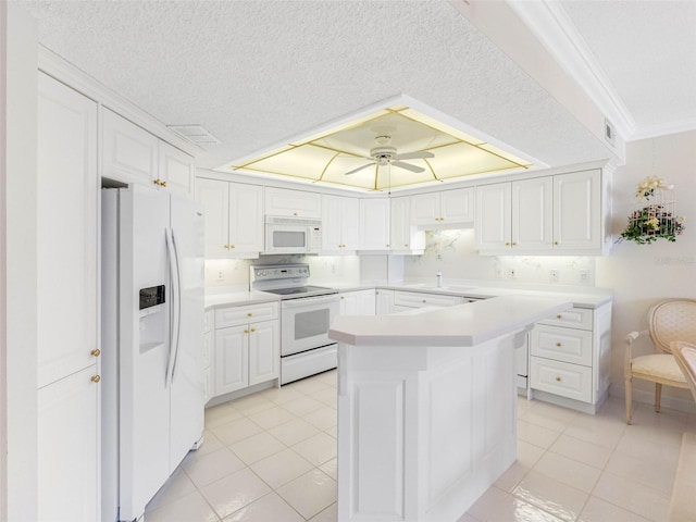 1400 Gulf Blvd Unit 511, Clearwater Beach, FL 33767 - kitchen featuring white cabinets, white appliances, ornamental molding, and light tile patterned floors