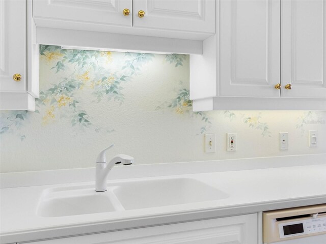 1400 Gulf Blvd Unit 511, Clearwater Beach, FL 33767 - room details with light countertops, a sink, white cabinetry, and white dishwasher