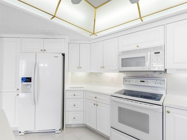 1400 Gulf Blvd Unit 511, Clearwater Beach, FL 33767 - kitchen featuring white cabinetry, light tile patterned floors, light countertops, and white appliances