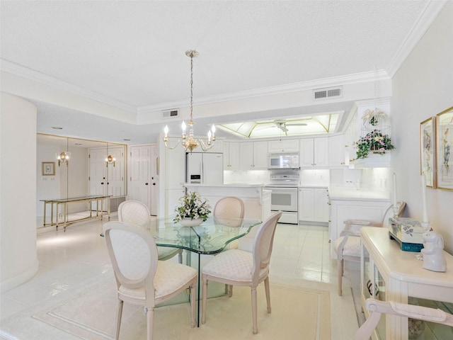 1400 Gulf Blvd Unit 511, Clearwater Beach, FL 33767 - dining space with a notable chandelier, visible vents, crown molding, and light tile patterned flooring