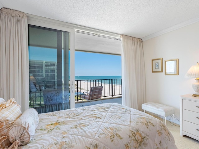1400 Gulf Blvd Unit 511, Clearwater Beach, FL 33767 - bedroom featuring a water view, carpet, a textured ceiling, crown molding, and access to exterior