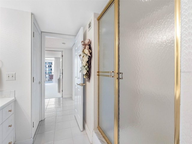 1400 Gulf Blvd Unit 511, Clearwater Beach, FL 33767 - full bath featuring tile patterned floors, vanity, baseboards, and a stall shower