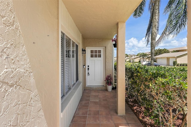 6490 Cape Hatteras Way NE Unit 4, Saint Petersburg, FL 33702 - property entrance with stucco siding