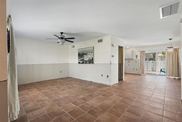 6490 Cape Hatteras Way NE Unit 4, Saint Petersburg, FL 33702 - spare room featuring dark tile patterned flooring, visible vents, and ceiling fan