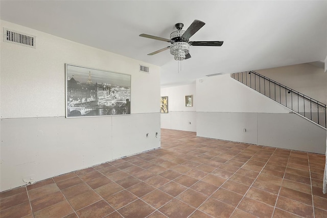 6490 Cape Hatteras Way NE Unit 4, Saint Petersburg, FL 33702 - unfurnished living room featuring ceiling fan, visible vents, and stairway