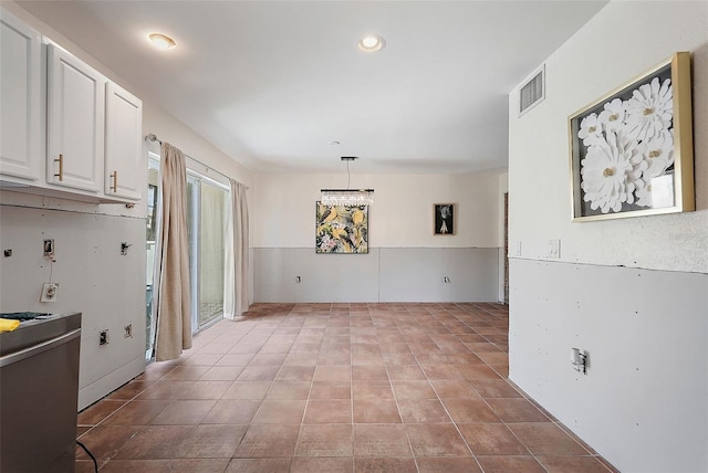 6490 Cape Hatteras Way NE Unit 4, Saint Petersburg, FL 33702 - unfurnished dining area featuring tile patterned floors and visible vents