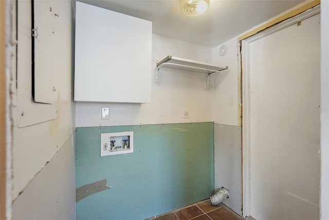 6490 Cape Hatteras Way NE Unit 4, Saint Petersburg, FL 33702 - washroom with dark tile patterned floors, hookup for a washing machine, and laundry area