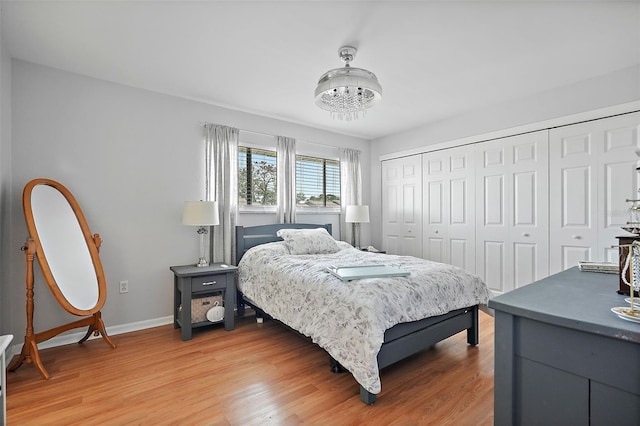 6490 Cape Hatteras Way NE Unit 4, Saint Petersburg, FL 33702 - bedroom featuring light wood-type flooring, a closet, and baseboards