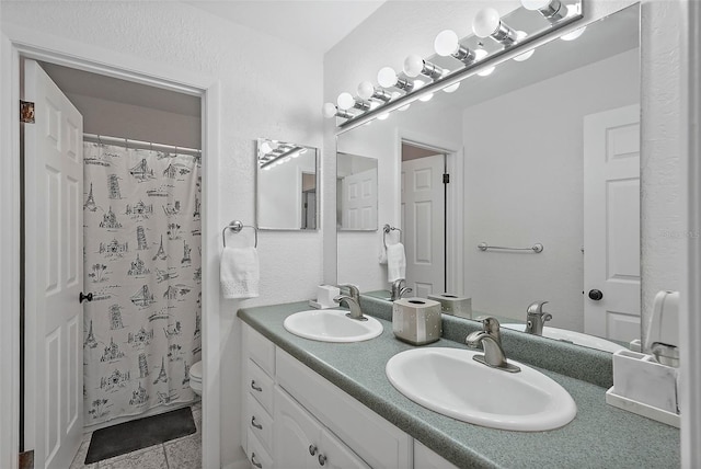 6490 Cape Hatteras Way NE Unit 4, Saint Petersburg, FL 33702 - full bath featuring a sink, toilet, double vanity, and a shower with curtain