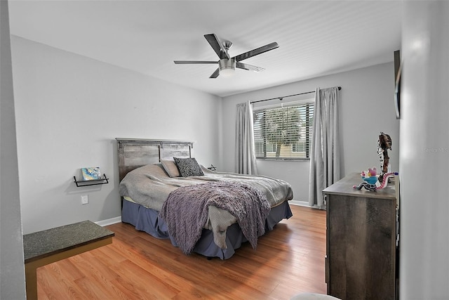 6490 Cape Hatteras Way NE Unit 4, Saint Petersburg, FL 33702 - bedroom featuring light wood-style flooring, ceiling fan, and baseboards