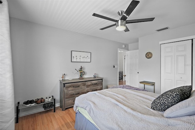6490 Cape Hatteras Way NE Unit 4, Saint Petersburg, FL 33702 - bedroom featuring baseboards, a closet, a ceiling fan, visible vents, and wood finished floors