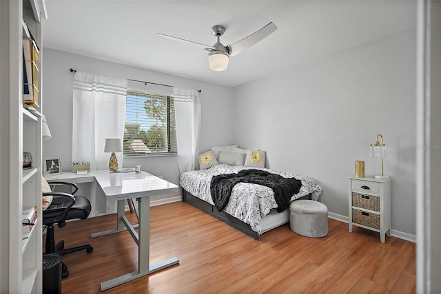 6490 Cape Hatteras Way NE Unit 4, Saint Petersburg, FL 33702 - bedroom with wood finished floors, ceiling fan, and baseboards