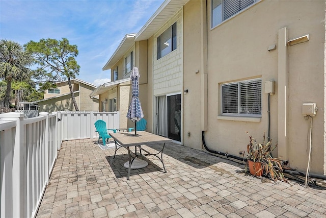 6490 Cape Hatteras Way NE Unit 4, Saint Petersburg, FL 33702 - view of patio / terrace featuring a fenced backyard