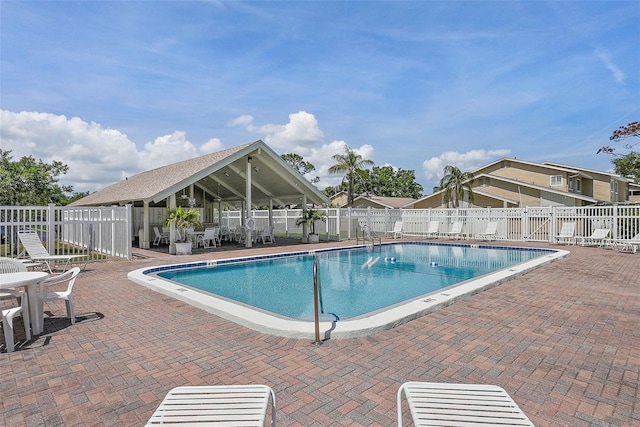6490 Cape Hatteras Way NE Unit 4, Saint Petersburg, FL 33702 - community pool featuring a patio area and fence