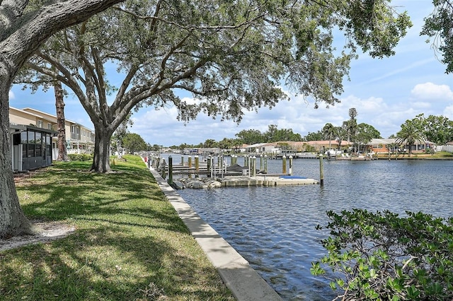 6490 Cape Hatteras Way NE Unit 4, Saint Petersburg, FL 33702 - view of dock featuring a water view and a lawn