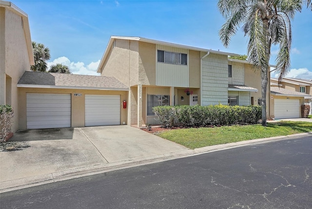 6490 Cape Hatteras Way NE Unit 4, Saint Petersburg, FL 33702 - multi unit property featuring a garage, stucco siding, and concrete driveway