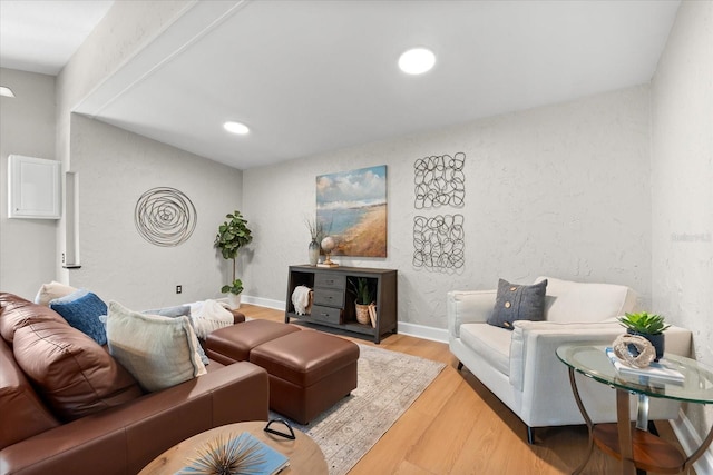 living room featuring light wood-type flooring and recessed lighting