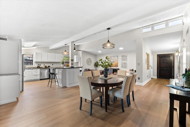 dining area with beamed ceiling, light wood-style flooring, baseboards, and recessed lighting