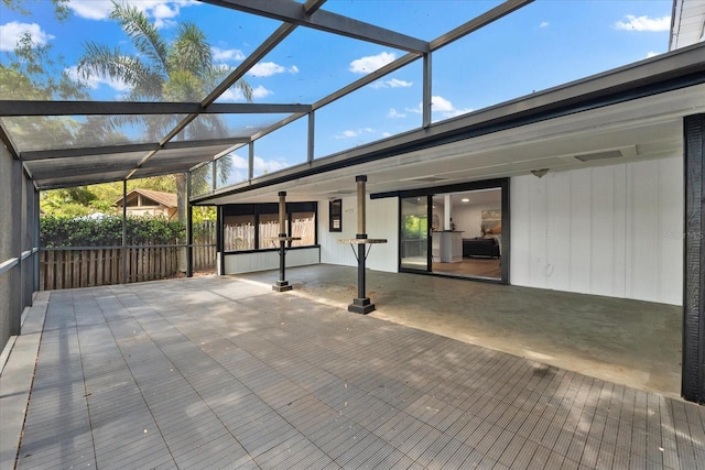 view of patio / terrace featuring a lanai