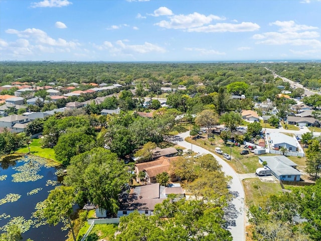 aerial view of residential area featuring a nearby body of water