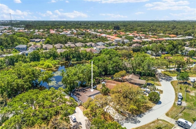view of property location with nearby suburban area, a nearby body of water, and property parcel outlined