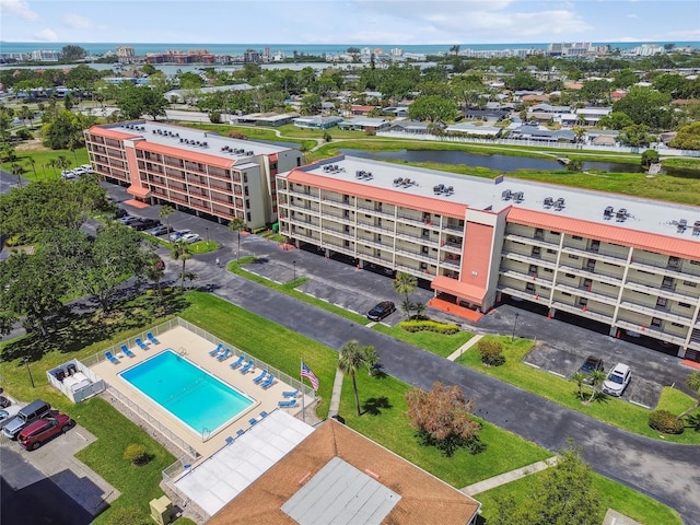 birds eye view of property with a water view
