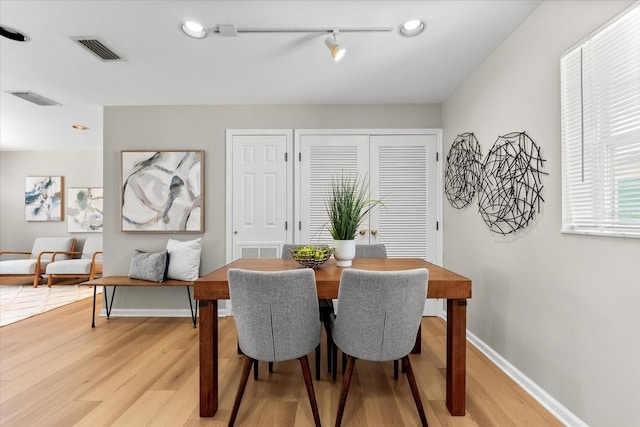 1232 Sedeeva Cir S, Clearwater, FL 33755 - dining space featuring light wood-style floors and track lighting