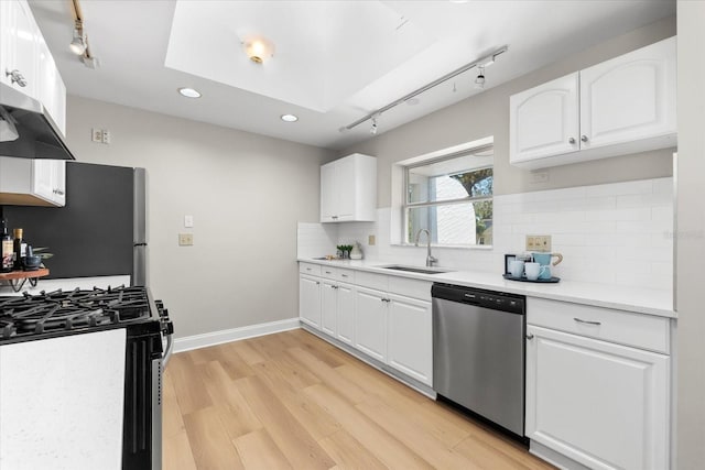 1232 Sedeeva Cir S, Clearwater, FL 33755 - kitchen featuring appliances with stainless steel finishes, ventilation hood, rail lighting, light wood-style flooring, and recessed lighting