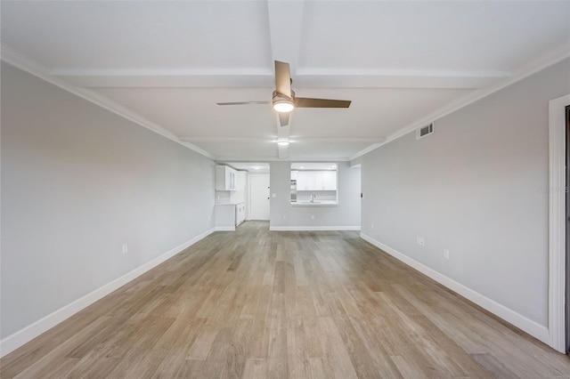 unfurnished living room with light wood-style flooring, crown molding, baseboards, and a ceiling fan