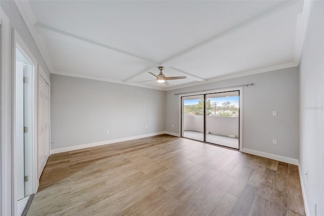 spare room with light wood-style floors, crown molding, ceiling fan, and baseboards