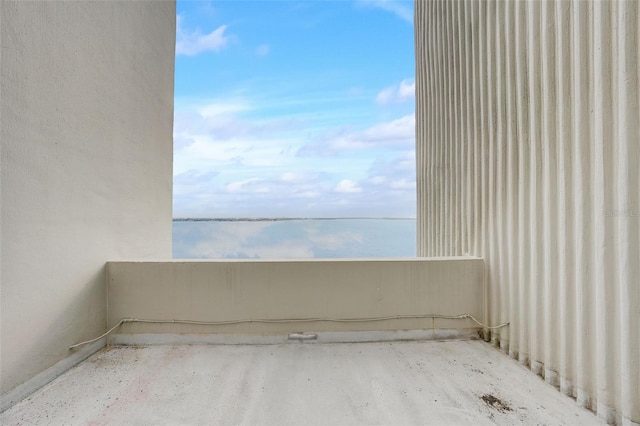 spare room with a water view