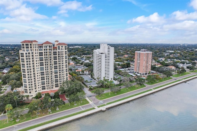 bird's eye view featuring a water view and a view of city