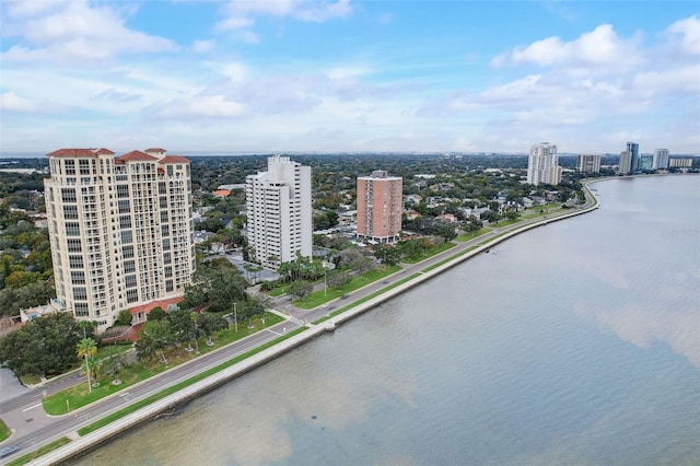 bird's eye view featuring a water view and a view of city