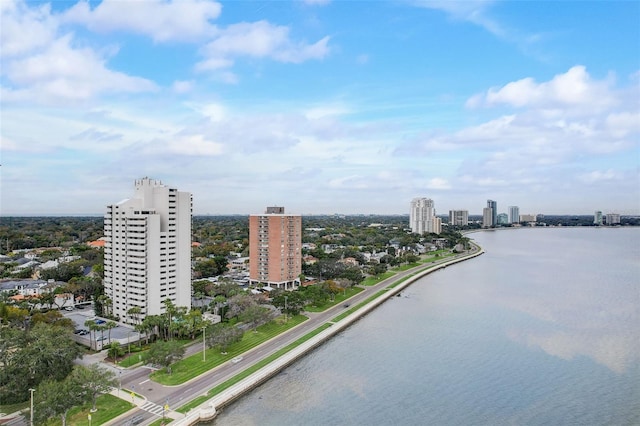 birds eye view of property featuring a view of city and a water view