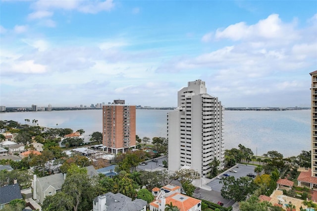 drone / aerial view featuring a view of city and a water view