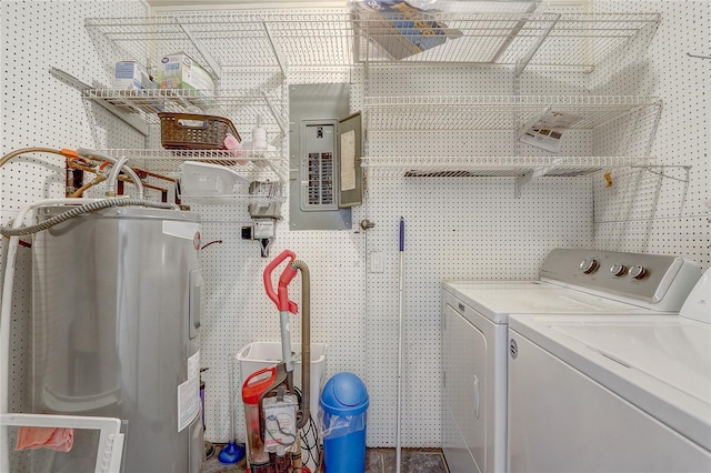 clothes washing area with washer and dryer, laundry area, electric water heater, and electric panel