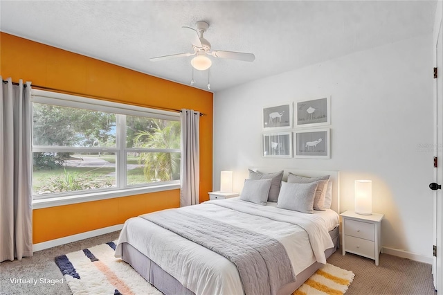 bedroom featuring baseboards and a ceiling fan