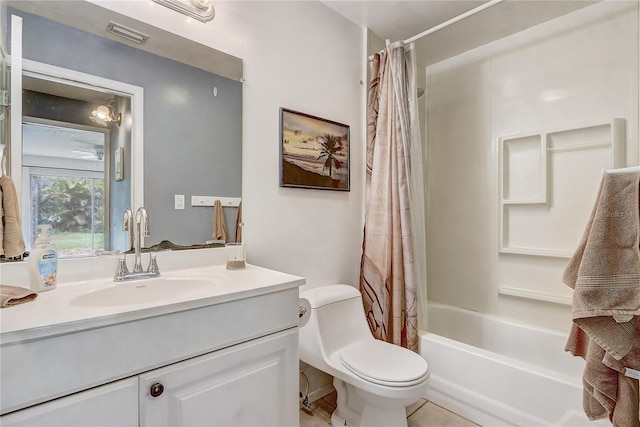 bathroom with toilet, vanity, shower / tub combo with curtain, and visible vents