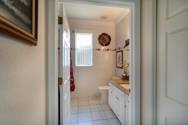 bathroom featuring vanity, toilet, tile patterned flooring, and crown molding