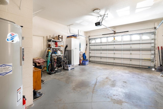 garage with water heater and a garage door opener
